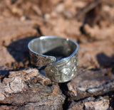 Adjustable wide band flower ring