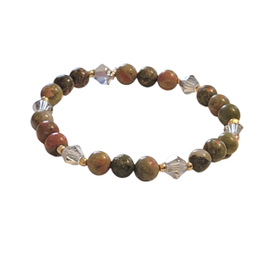 Aventurine green stone bracelet with gold accents and Grey bicone crystals. Local to central Florida. Jewelry store.