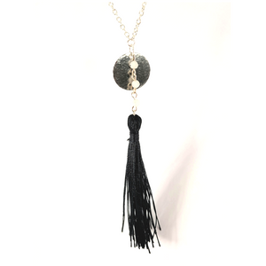 Black tassel silver necklace with moon stone links and a hammered silver disc layered on top. Central florida jeweler.
